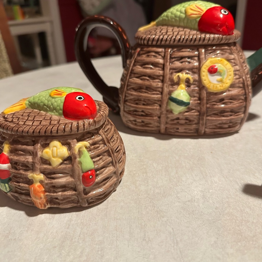 Fishing teapot, creamer, and sugar bowl